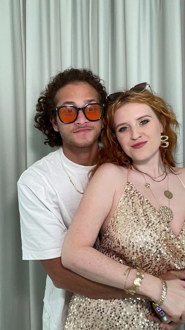 Guests posing in the Electric Vibe photo booth