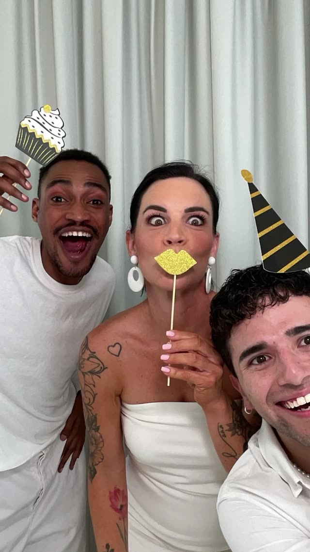 Guests with props in the photo booth